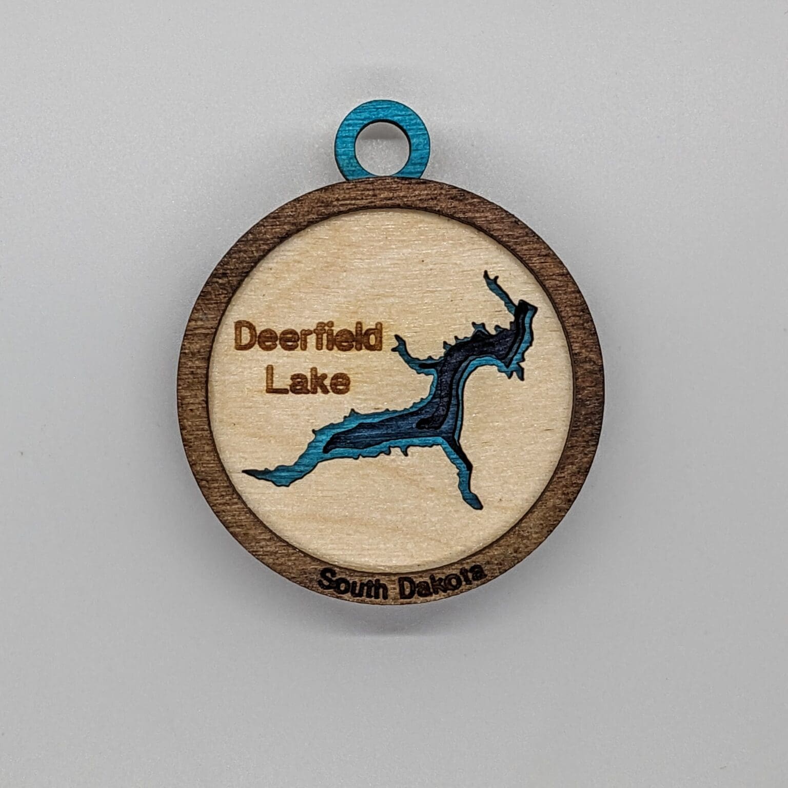 Custom wood ornament with a Deerfield lake map design
