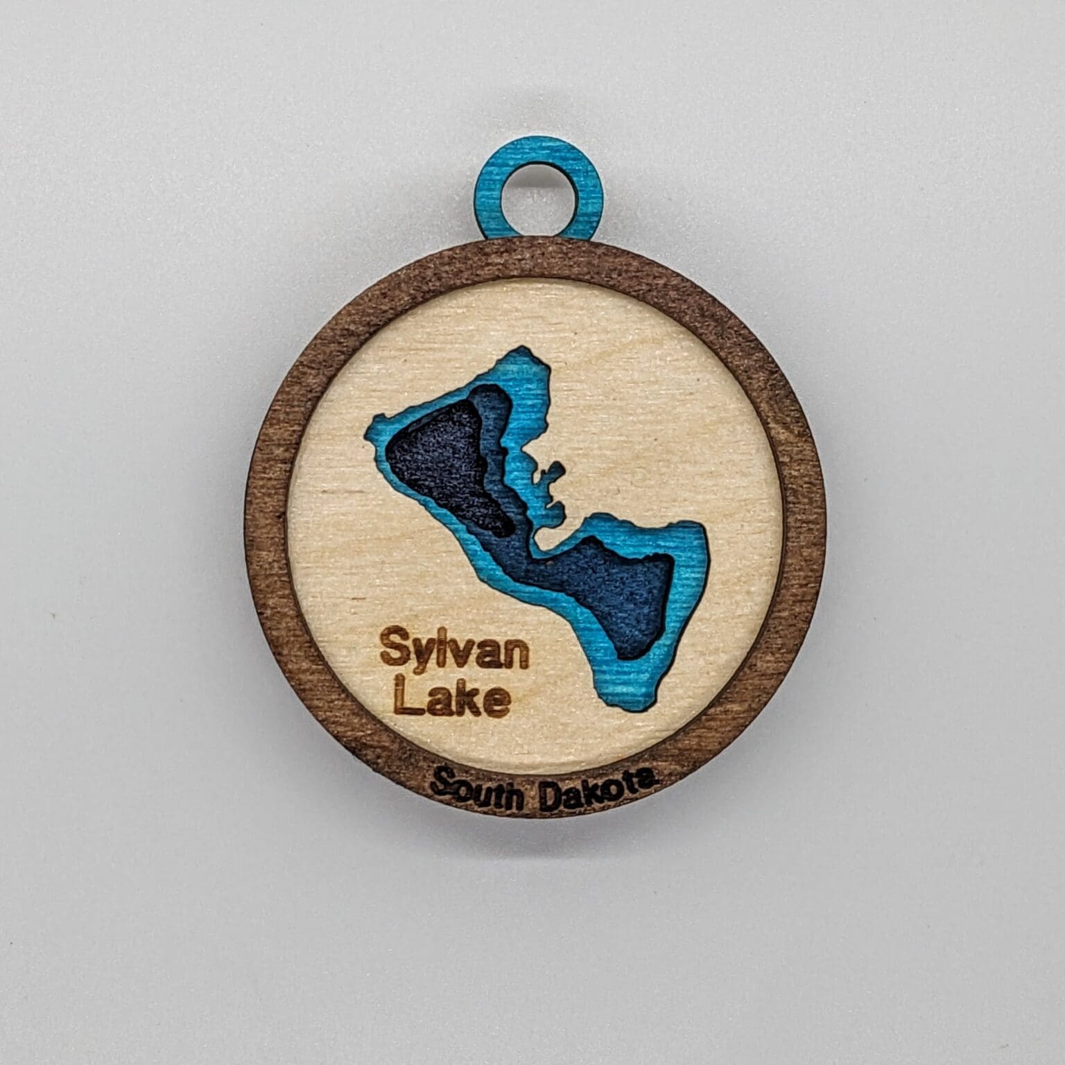 Custom wood ornament with a Sylvan Lake map design