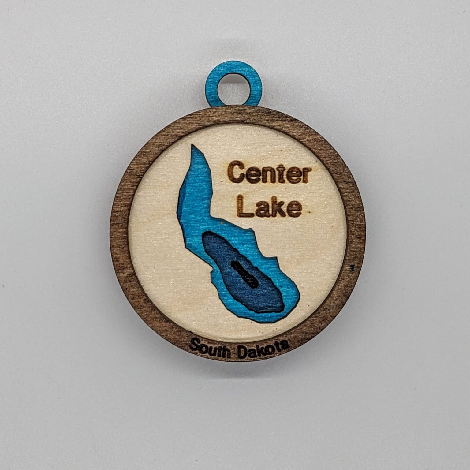 Custom wood oranment with a center lake map design