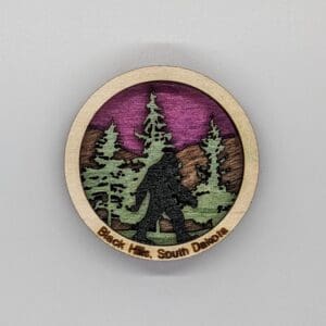 Custom wood magnet depicting sasquatch in the woods
