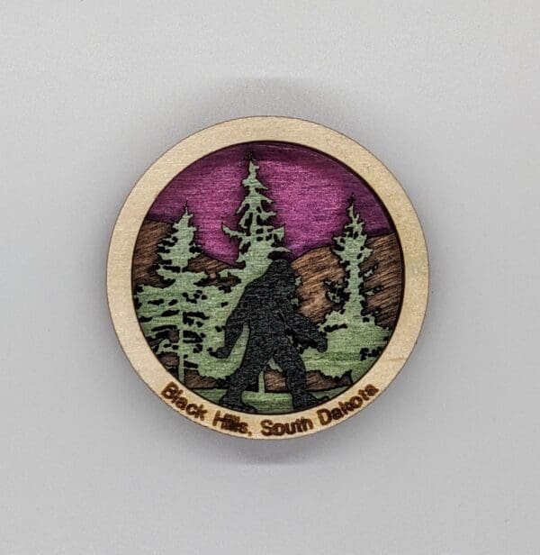 Custom wood magnet depicting sasquatch in the woods