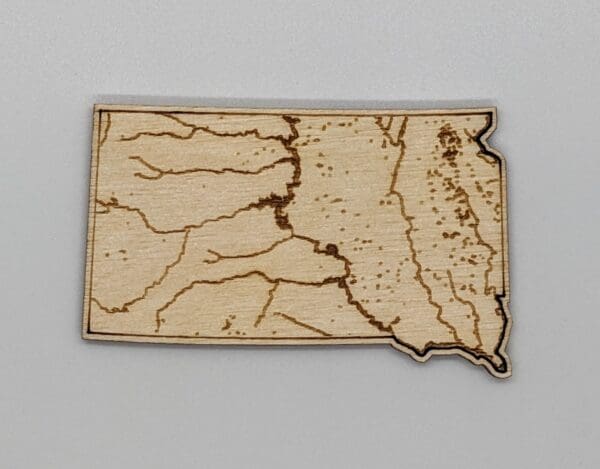 Custom wood magnet showing the bodies of water in South Dakota