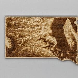 Custom South Dakota shaped wood magnet depicting the topography of the state