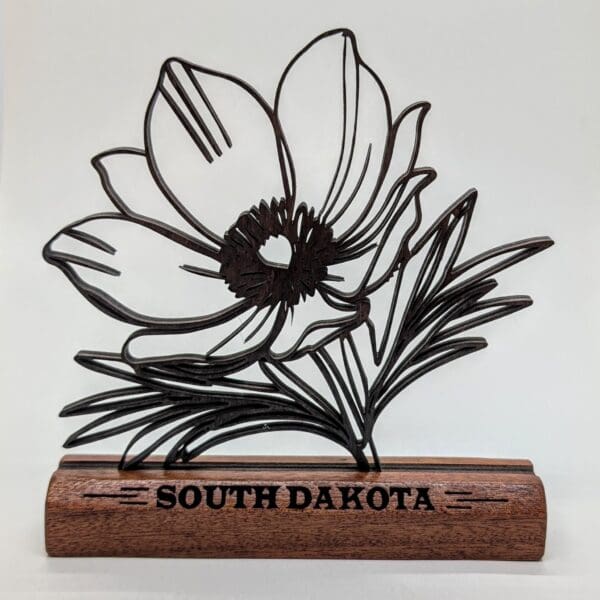 Custom wood continuous line sculpture of a prairie pasque