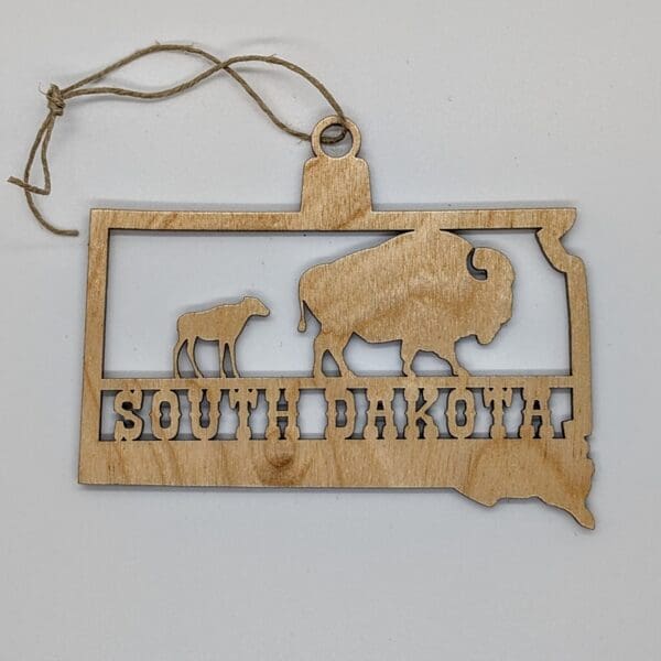 Custom South Dakota shaped wood Ornament with a buffalo and calf with South Dakota text