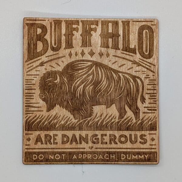 Wood sticker with a buffalo and buffalo are dangerous do not approach, dummy text