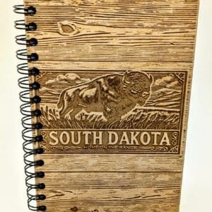 Wooden journal cover with South Dakota and a bison