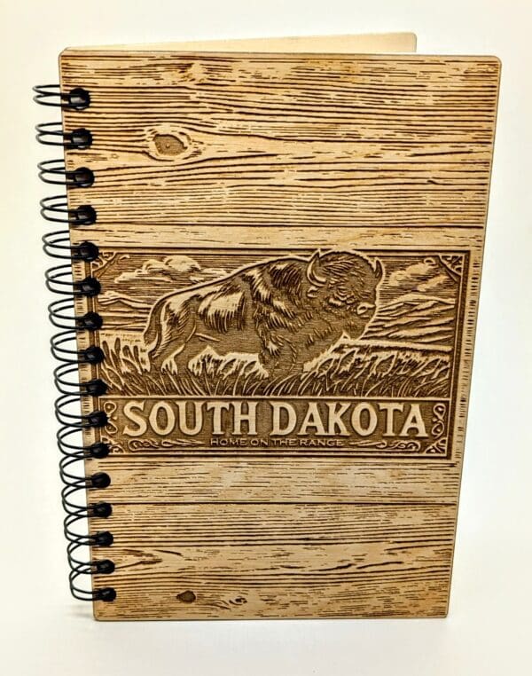 Wooden journal cover with South Dakota and a bison