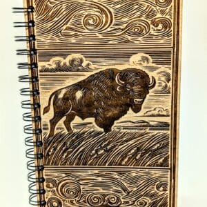 Wooden journal cover with a bison on the prairie