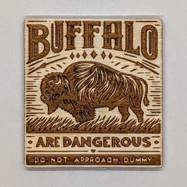 Wooden buffalo magnet with buffalo are dangerous do not approach, dummy text